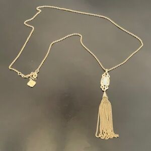 Kendra Scott Tassel necklace in gold with white stone.